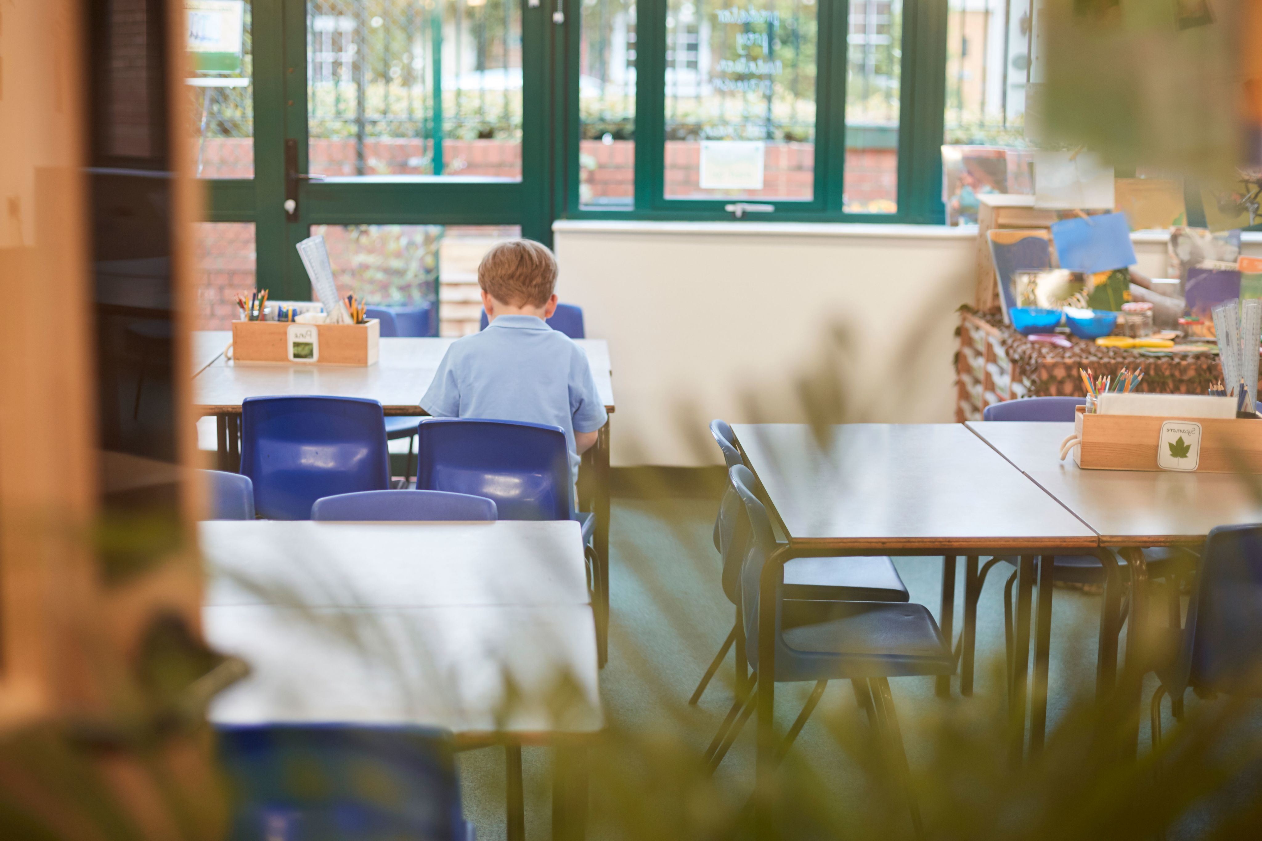 Child alone in classroom