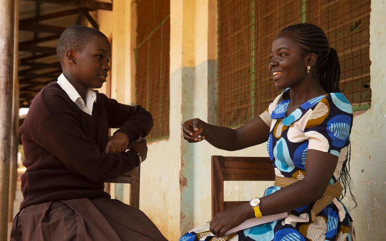    Sophia (right), a CAMFED Learner Guide, with secondary student Hanipha, who she supports at school